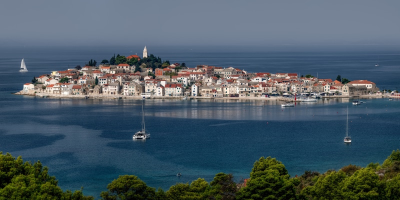 Island town in Croatia with sailboats on the sea