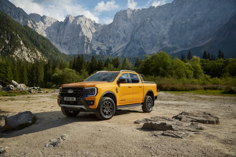 Yellow Ford Ranger Wildtrak Pickup Truck in Mountains