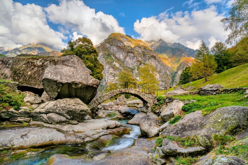 Stone bridge over a stream in the Swiss Alps