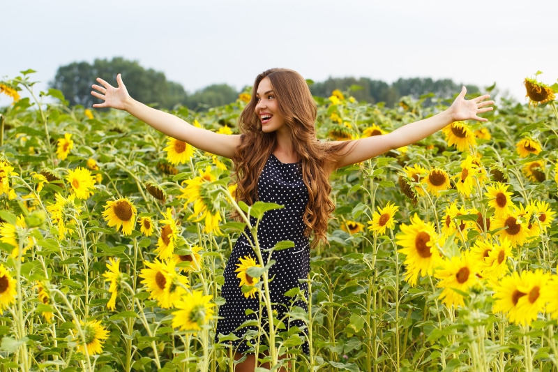 Woman in Sunflower Field
