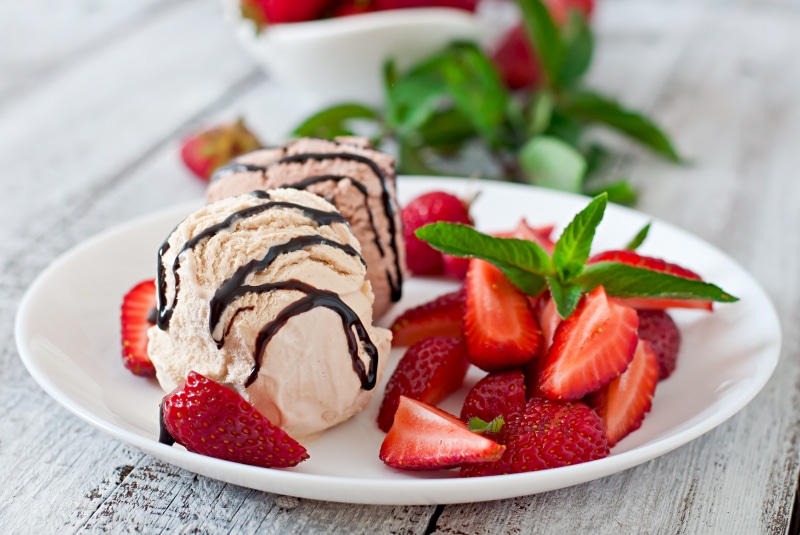 Ice cream with strawberries on a plate