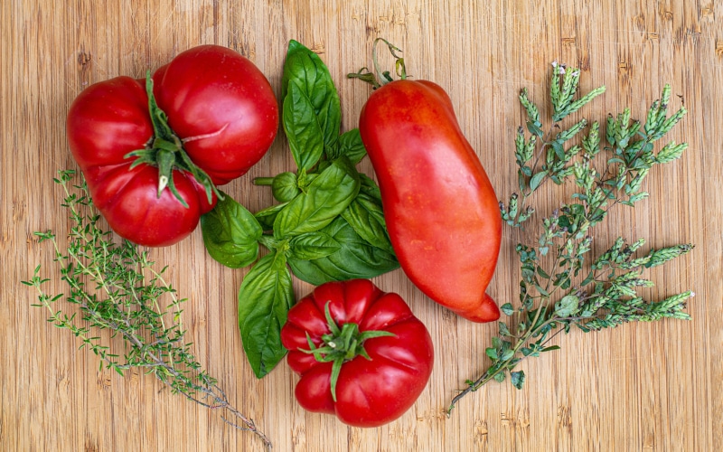 Tomatoes and Basil on a Wooden Surface