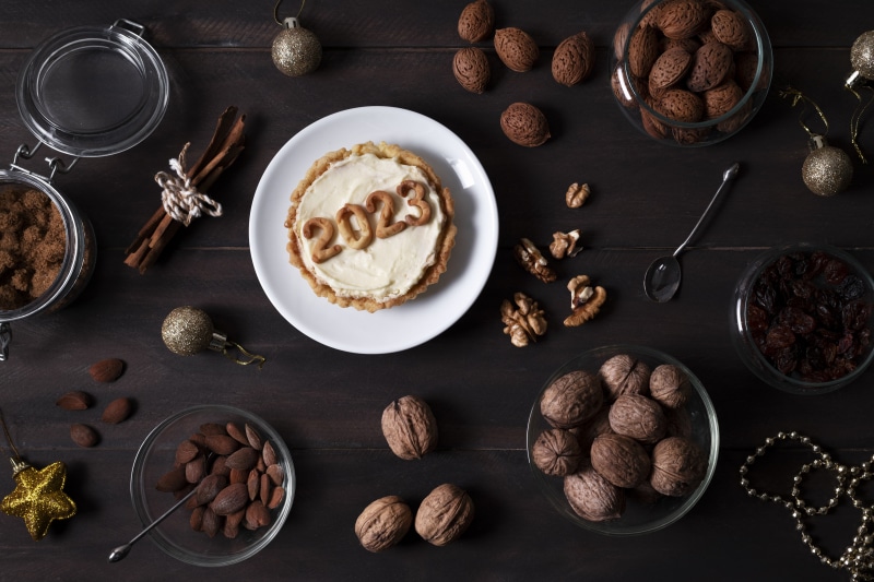 New Year's Tart with 2023 decoration and nuts