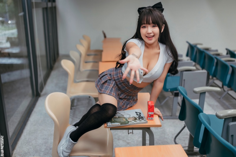 Asian woman in school uniform in classroom