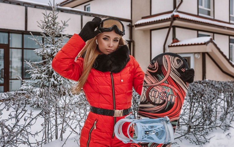 Anastasia Zakharova snowboarding in winter