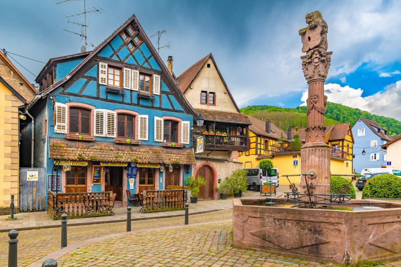 Half-timbered houses and fountain in France
