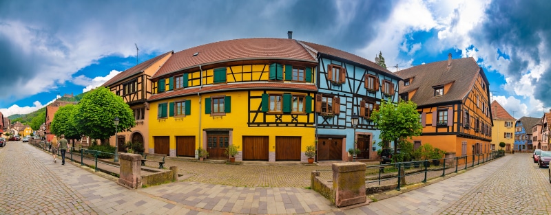 Colorful half-timbered houses on a street in France