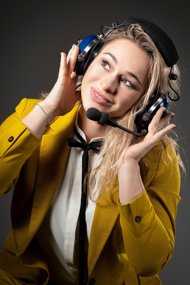 Aleksandra with headphones and microphone