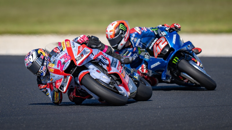 Two motorcyclists racing on a track