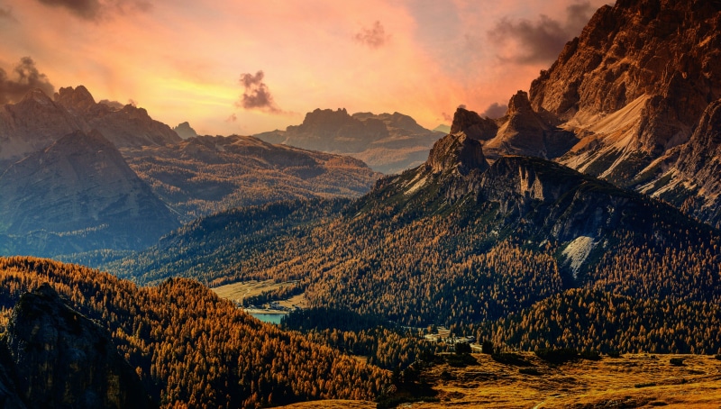 Mountains and Autumn Forest at Sunset in Italy