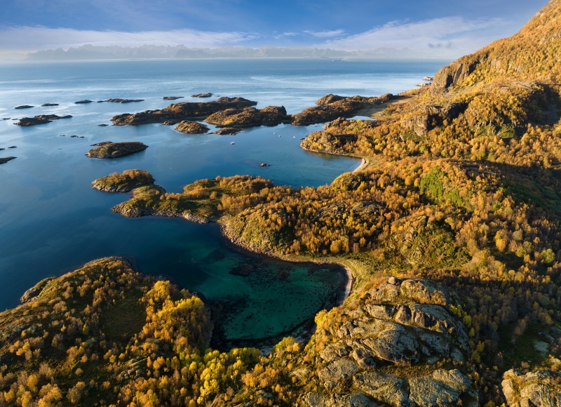 Aerial view of Nordlandsvika bay in Norway with autumn foliage