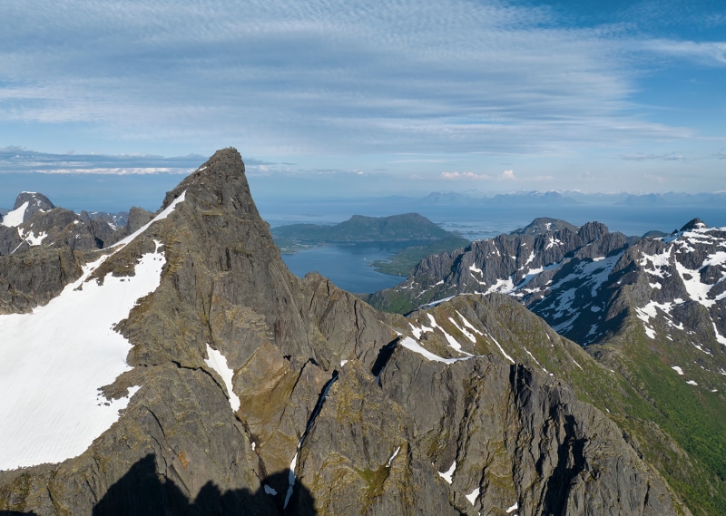 Rocky Mountains with Snow and a Fjord in Norway