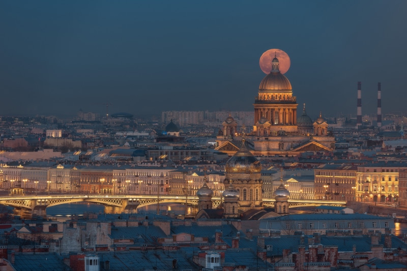 Saint Isaac's Cathedral in St. Petersburg at dusk with the moon