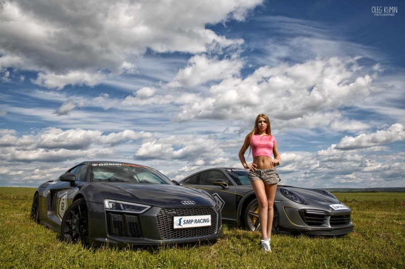 Yulia Buyanova with Audi and Porsche cars