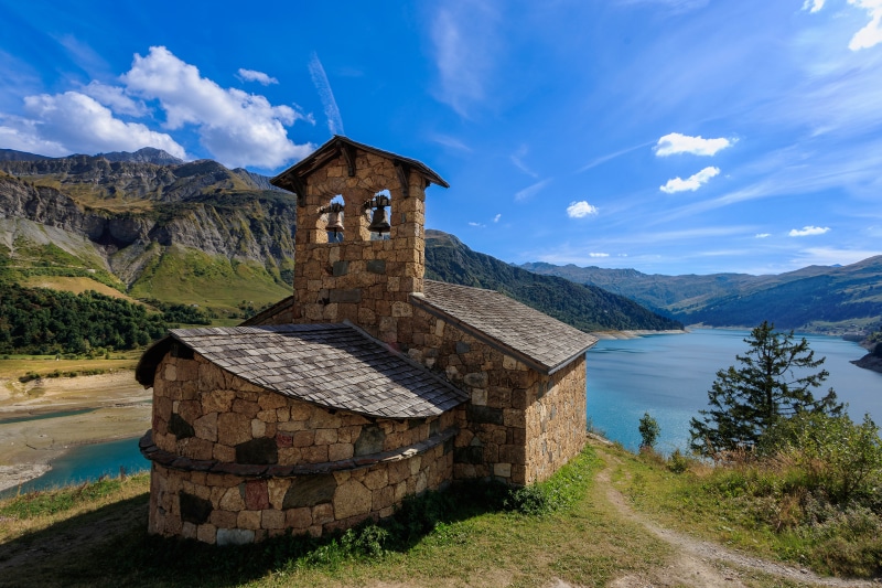 Stone church with bells by Roselend lake, Savoie, France