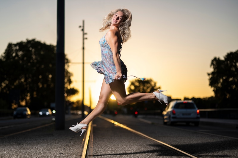 Aleksandra jumping with a dress and stilettos
