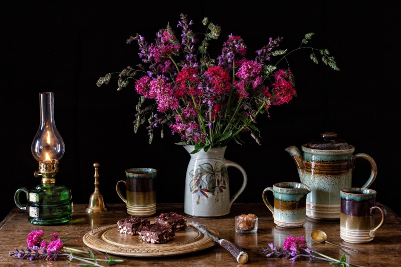 Still-life with flowers, cakes, and kerosene lamp