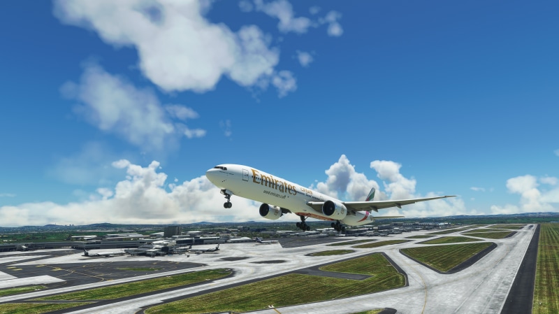 Emirates Boeing 777-300ER taking off from airport