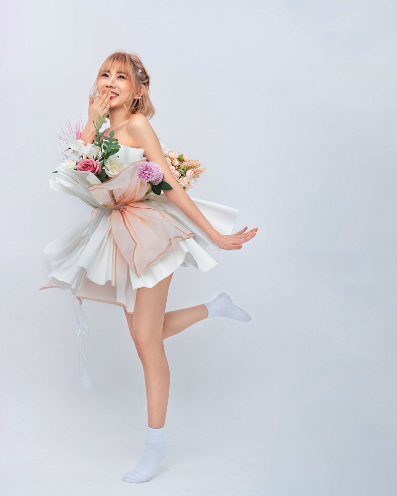 Asian woman in floral dress and white socks