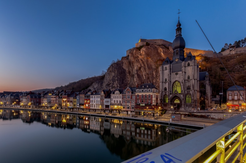 Dinant, Belgium: Church, River, and Mountains at Dusk