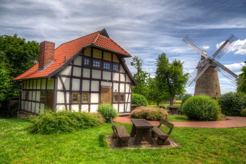 Half-timbered house and windmill in Eilhausen, Germany