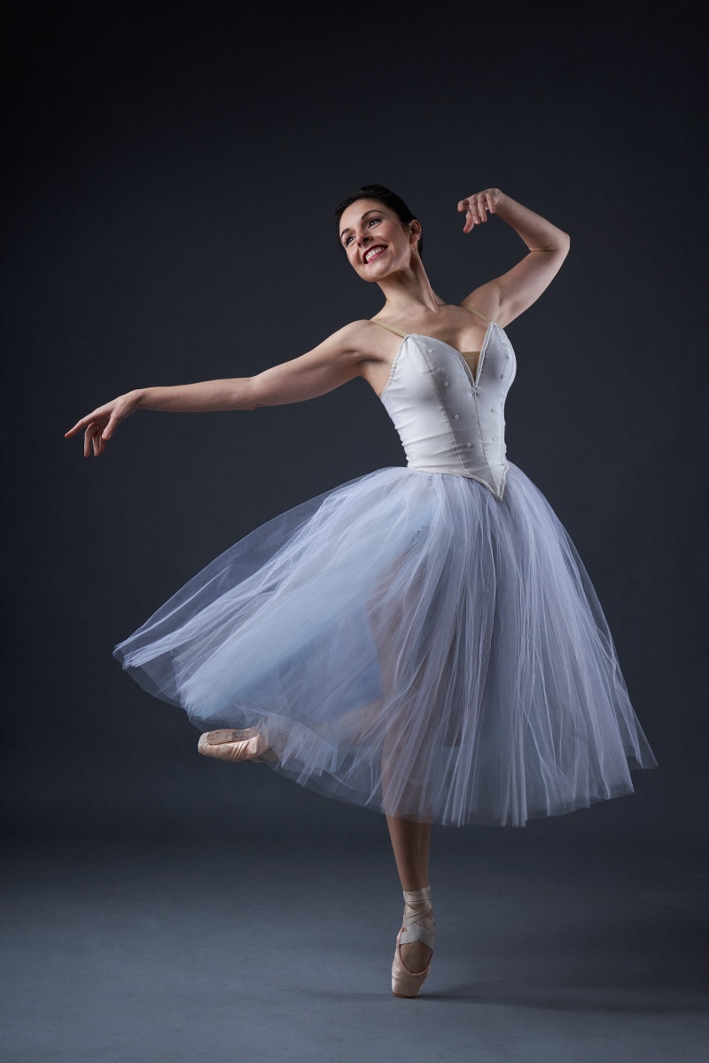 Rosana performing ballet in a white tutu