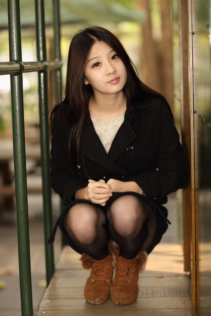 Brunette girl in coat and pantyhose