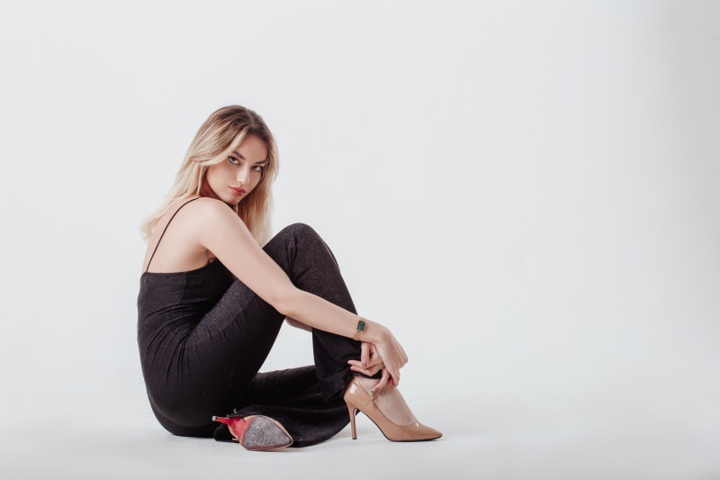 Anastasia sitting on gray background