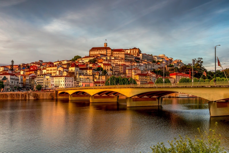 Coimbra, Portugal: Cityscape with Bridge and River