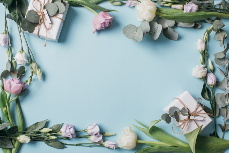 Gifts and flowers on a blue background