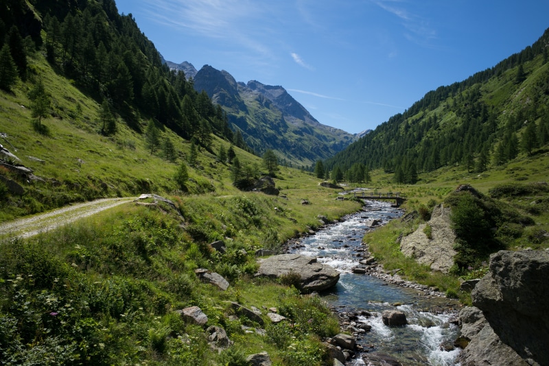 River flowing through a valley in Olivone, Switzerland