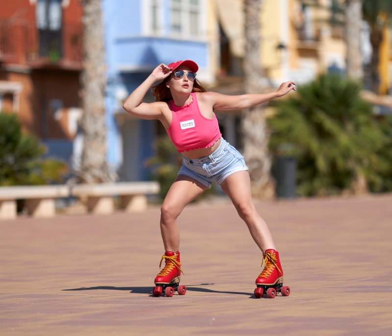 Woman in roller skates and shorts