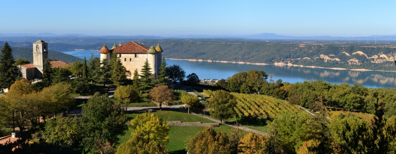 Sainte-Croix lake panorama with castle and church