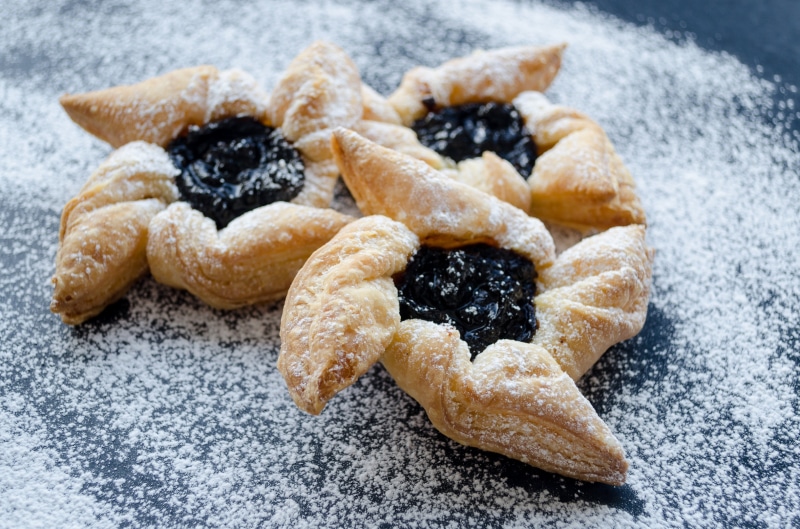 Pastries with jam and powdered sugar