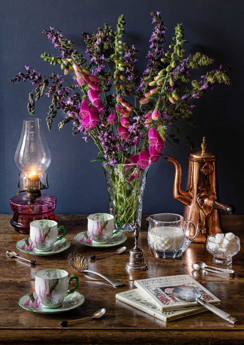 Tea set with flowers and books