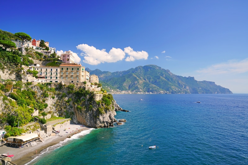 Houses on a cliff overlooking the sea in Atrani, Italy