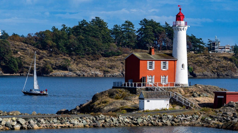 Fisgard Lighthouse and sailboat in Colwood, Canada