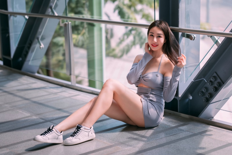 Asian woman sitting on the floor