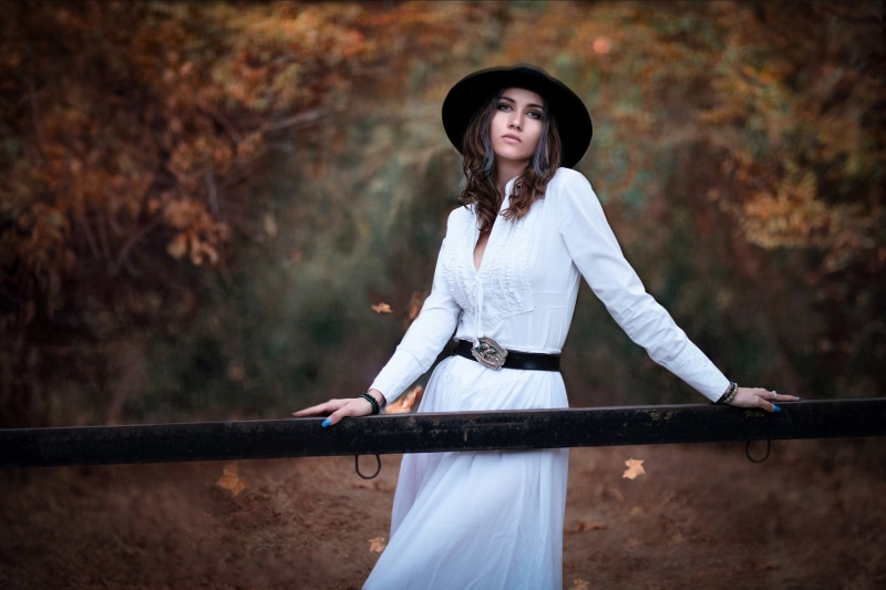 Woman in white dress and hat