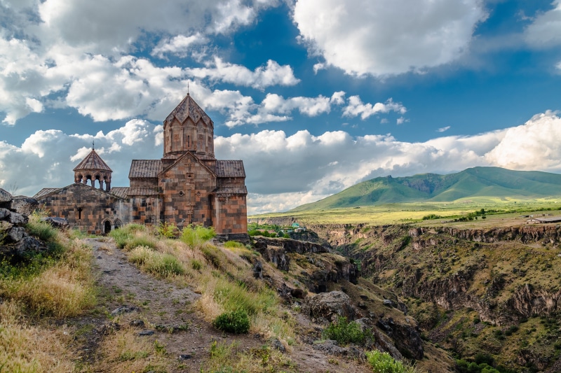Hovhannavank Monastery in Armenia with Mountains and Clouds