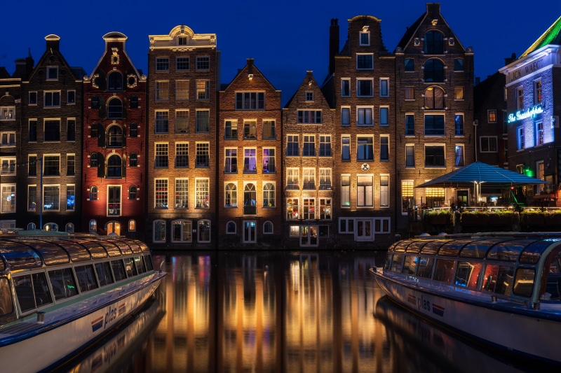 Amsterdam Canal Houses and Riverboats at Night