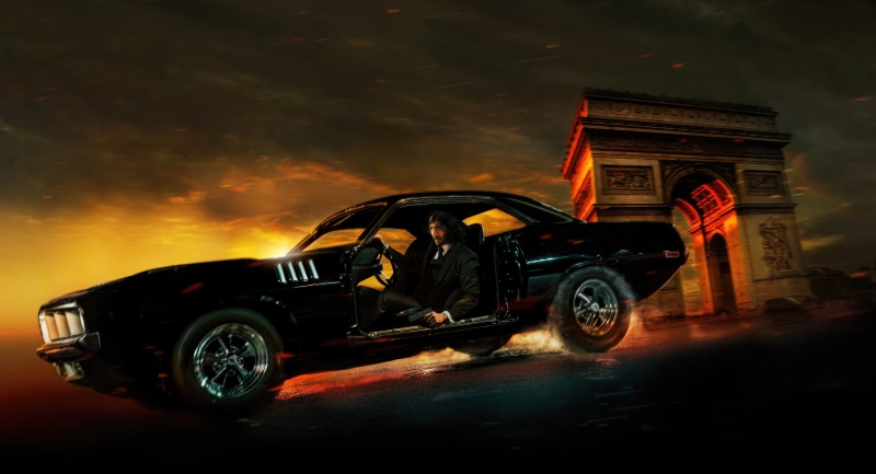 John Wick from John Wick Chapter 4 driving a car in Paris