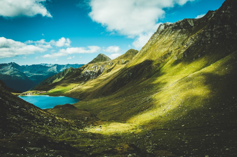 Mountain landscape with a blue lake and green hills