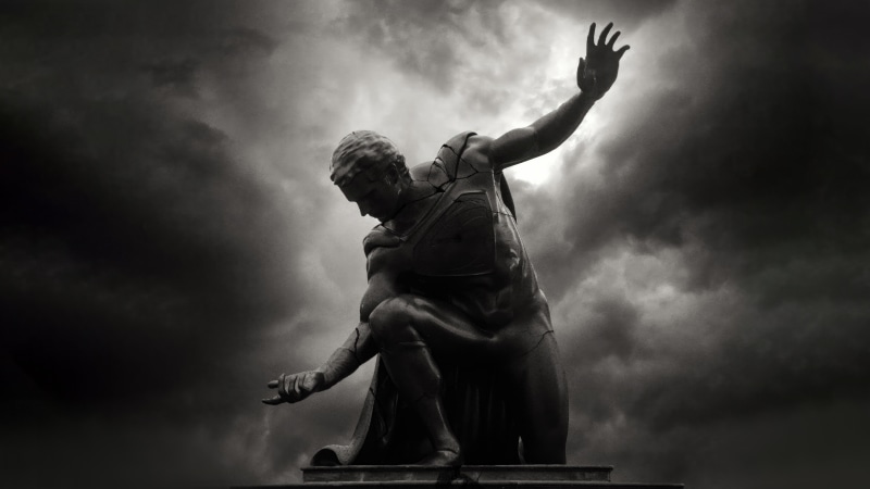 Cracked Statue Against Stormy Sky