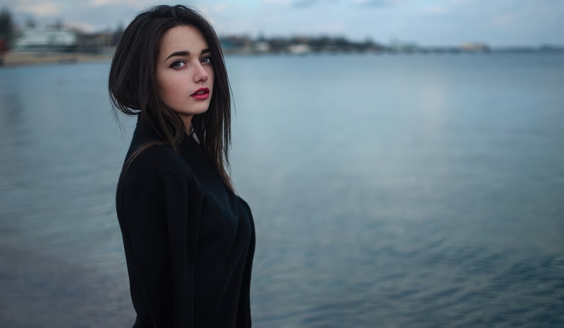 Girl in black dress by the water 4K