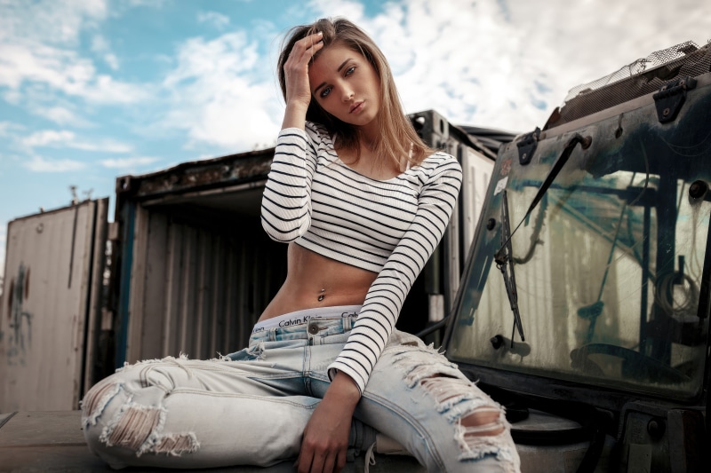 Model in Calvin Klein underwear and ripped jeans