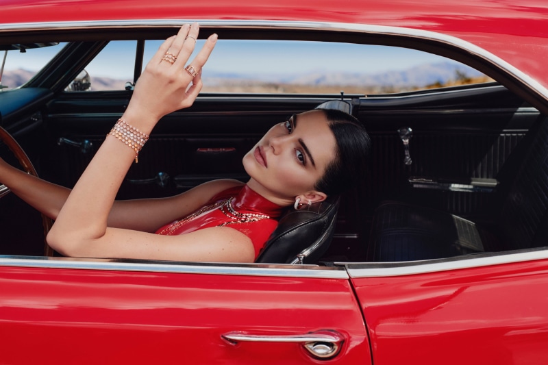 Kendall Jenner in a red dress in a car