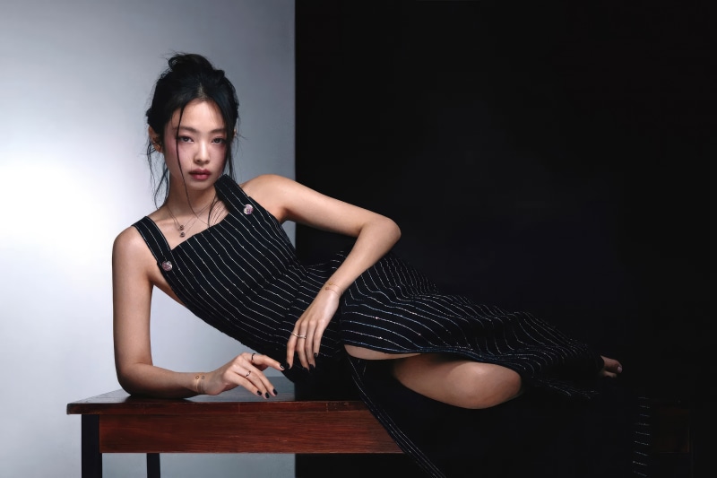 Jennie Kim in a black pinstripe dress