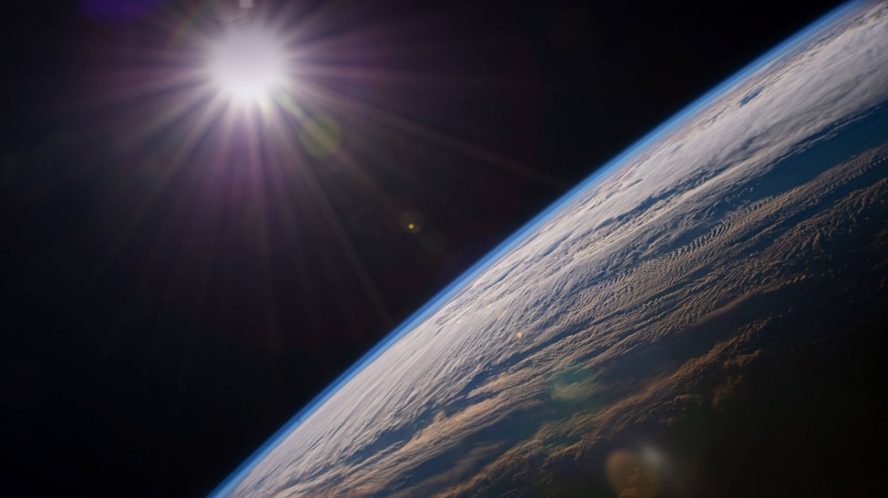 Earth from space with sun glare