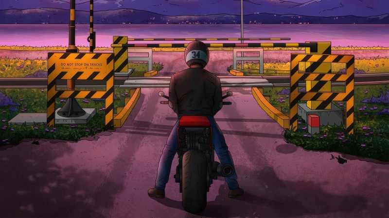 Biker at a railroad crossing at dusk